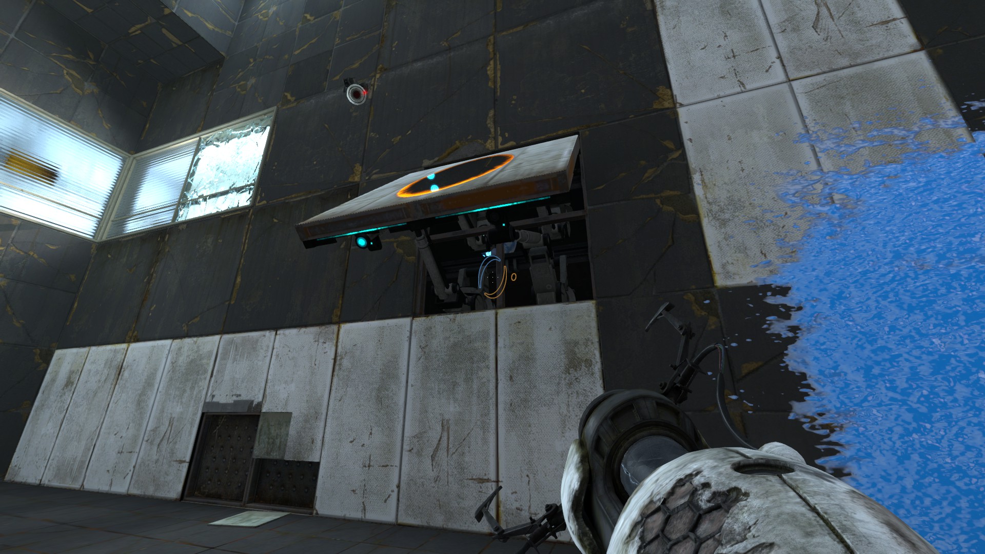 A screenshot of Portal: Revolution. I am looking at a portal-able panel that is raised off the wall at an angle. It's a little hard to tell from the picture, but there's a ball covered in blue gel that fell behind this panel. I thought I was softlocked here, but I can reach the ball.
